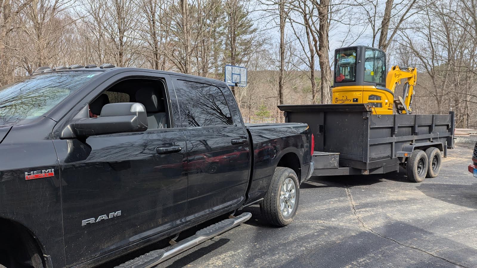 Professional equipment transport with excavator on trailer
