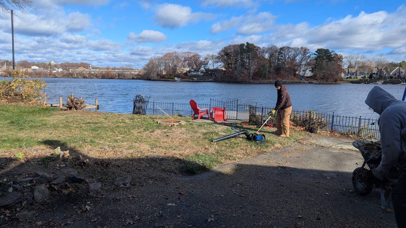 Team working on waterfront property landscaping